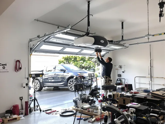 Security-Widefield Garage Door Repair specialist installing smart garage door opener system in Security-Widefield home