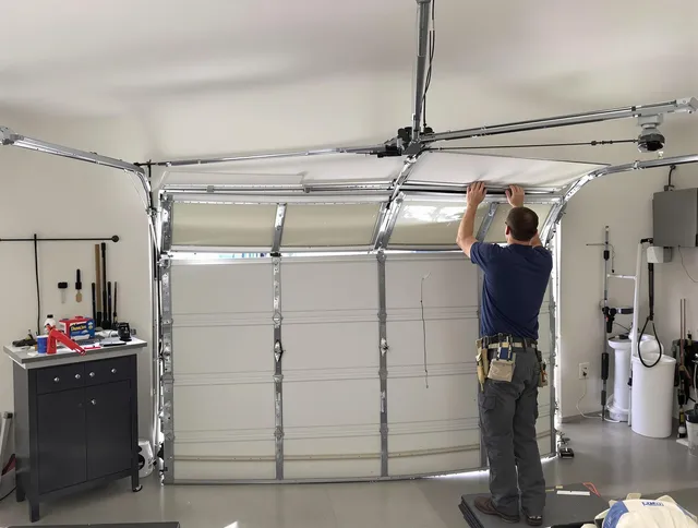 Security-Widefield Garage Door Repair specialist performing precise section replacement on Security-Widefield garage door