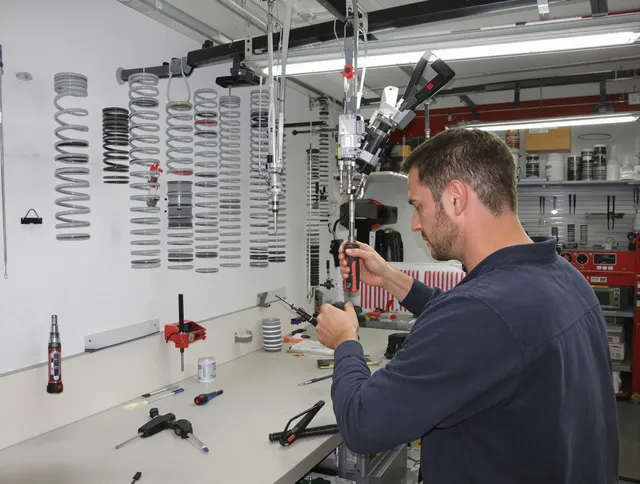 Security-Widefield Garage Door Repair safety certified technician performing precision spring replacement in Security-Widefield